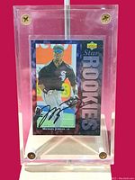 Front view of acrylic holder containing Michael Jordan baseball rookie card