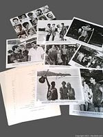 Photo showing various black and white stills from the movie 'Club in Paradise' along with typed script pages.