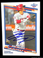 Front of card showing action photo, Bomb Squad text and blue ink autograph