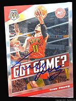 Front of the 2019 Panini Mosaic Trae Young basketball card showing player performing a layup in Atlanta Hawks red jersey #11 with 'Got Game?' and blue autograph.