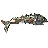 Side view of vintage metal fish sculpture showing mother of pearl inlays on segmented body