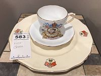 Tea cup and saucer with Royal Standard QEII 1953 Coronation design on Alfred Meakin plate with crests