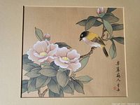 Photo of the full painting with bird and flowers, mounted on a wall.