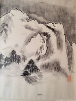 Detailed photo of the black and white mountain landscape painting showing brushwork and red stamp