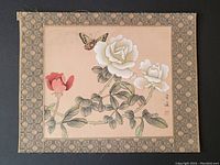 Full view of Chinese silk painting showing butterfly and flowers with decorative border on black background