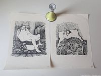 Top view of two large vintage black-and-white prints side by side with vintage Nippon ceramic candle holder placed above them casting shadow. Prints depict a man, one sitting on toilet, other reclining in bed with ornate patterns.