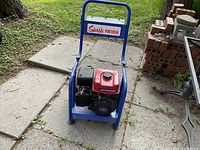 Front view of Swish PW1956 gas pressure washer with Mitsubishi motor on blue metal frame