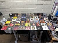 Overview shot showing all CDs laid out on a table with visible artwork and artists