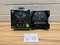 Photo of the PowerA Spectra Infinity Xbox controller, showing controller, cable, instruction manual, and box.
