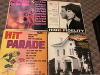 Vinyl album covers showing Rumba Rabo compilation, Mike Nichols and Elaine May, Hit Parade, and Still The One albums.