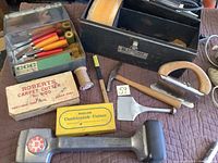 Mixed views of the carpet installation tools laid out on a brown surface