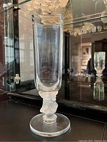 Front view showing rectangular clear crystal body and frosted stem