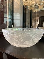 Side profile showing frosted relief arc and leaf pattern
