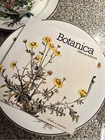 Villeroy & Boch Botanica brochure cover atop dinner plate