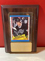 Front view of the Wayne Gretzky hockey card plaque showing Lois Angeles Kings jersey card and brass nameplate on wood plaque