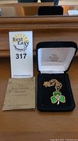 Photo of the pendant necklace in its black Franklin Mint box along with the certificate and lot tag.