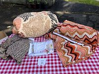 Vintage upholstery and cushion fabrics including animal print comforter and chevron patterned fabric