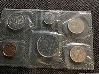 Clear image of the front side of all six sealed coins in the 1986 Canadian Royal Mint set showing denominations and details.