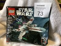 Front view of unopened LEGO Star Wars X-Wing Starfighter polybag set 30654 showing 87 pieces and age recommendation of 6+.