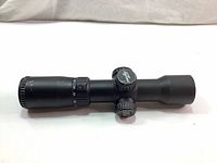 Side angle view of the black Excalibur Tact Zone crossbow scope showing the eyepiece, adjustment knobs and main tube.