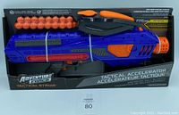 Full boxed view of the Adventure Force Tactical Strike Motorized Ball Blaster with 25 foam balls inside the packaging.