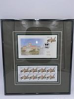 Framed and matted display of Canada Post University of Manitoba 48 cent postage stamps and First Day Cover.