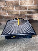 Full view of the Mastercraft wet tile saw showing the entire cutting surface and body.