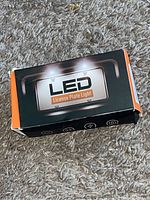 Box front showing LED License Plate Light branding