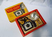 Original Kodak Brownie Holiday Flash Outfit box with camera and flash attachment seated inside the box showing packaging and item condition