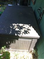 Top view of the garden storage box showing flat lid with wear marks