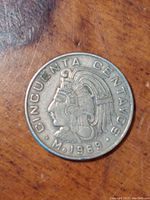 Close-up photo of the obverse side of the 1969 Mexican 50 centavos coin showing the bust of Cuauhtemoc with inscription and year.