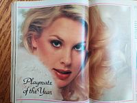 Close-up of Dorothy Stratten on a two-page interior photo spread labeled Playmate of the Year showing a portrait with fur collar.