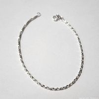 Silver box chain bracelet laid flat showing entire length and clasp