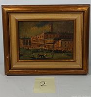 Front view of framed artwork showing Venice canal scene.