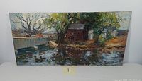 Front view of the landscape oil painting on board showing pond, bridge, trees, and people.