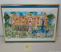 Framed colorful lithograph showing a palace with guards and people, with blue mat and light wooden frame.