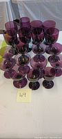 Full set of 16 amethyst stemmed glasses including various sizes as cordial, water and wine glasses.