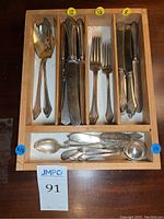 Tray with all flatware pieces arranged by type