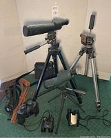 Group view of telescopes, tripods, and binoculars