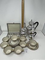 Front view of entire lot against white background with measuring stick