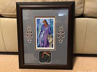 Full view of framed artwork showing the entire frame with the print and horsehair display inside.