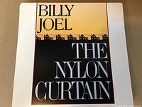 Front cover photo of Billy Joel The Nylon Curtain LP showing clean condition and clear lettering.