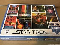 Box top showing full cover art with movie posters from Star Trek films and puzzle piece count 1000 pieces.