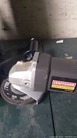 Side view of Craftsman angle grinder showing logo and disc guard.