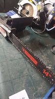 Close-up photo of the chainsaw blade showing the Mastercraft branding and length of 14 inches.