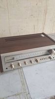 Front view of Pioneer SX-450 stereo receiver showing knobs and wood casing.