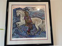 Full view of framed limited edition signed art print showing a woman and white horse on a stylized blue and purple background.