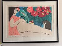 Front view of framed signed limited edition print depicting a reclining woman with flowers and cat in colorful stylized artwork.
