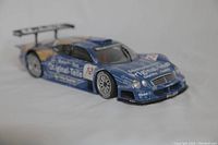 Front side angle of the blue 1/18 scale Mercedes Benz CLK GTR 1997 diecast model showing detailed racing livery and body contours.