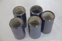 Five Edison Blue Amberol phonograph cylinders in dark blue color with visible label wear from the top view.